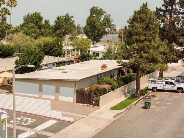 a view of a patio with a table and chairs