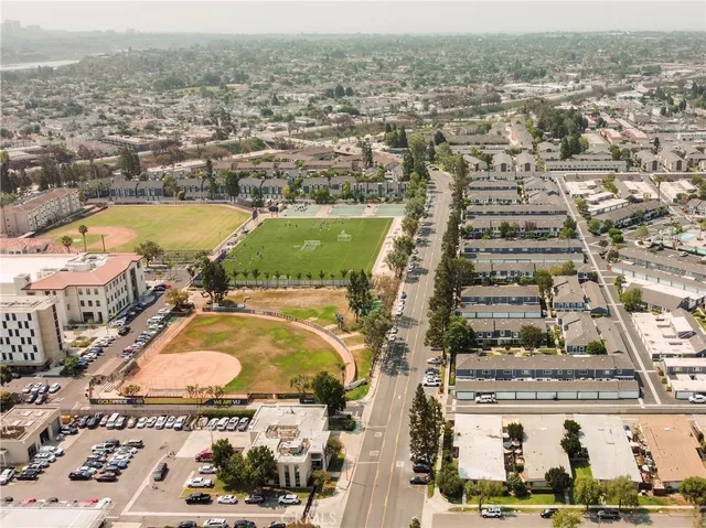 an aerial view of residential houses with outdoor space