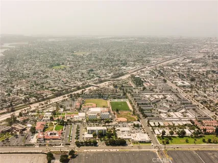 an aerial view of residential building and car parked