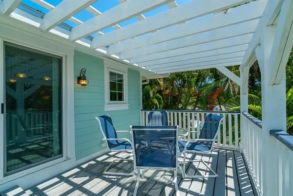 a view of balcony with furniture and wooden deck
