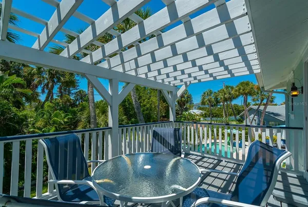 a view of a balcony with furniture