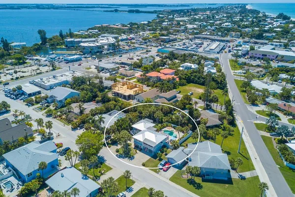 an aerial view of residential houses with outdoor space