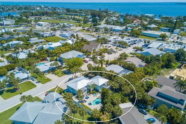 an aerial view of residential houses with outdoor space