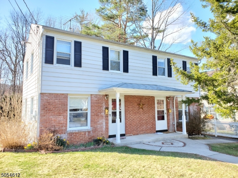 a front view of house with yard