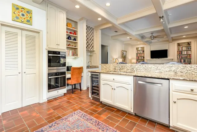 a spacious bathroom with a granite countertop sink and a mirror