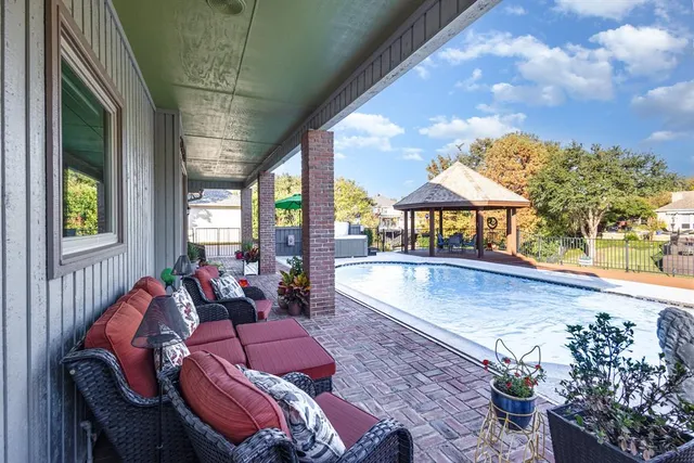 a front view of a house with porch and dining table