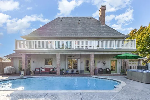 a view of a building with sitting area and furniture