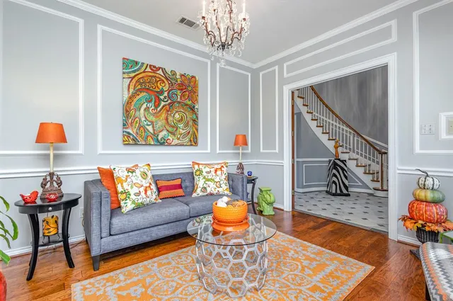 a reading room with furniture and wooden floor