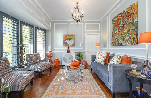 a living room with furniture fireplace and flat screen tv