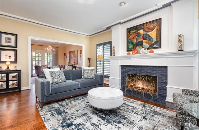a living room with furniture a window and a fireplace