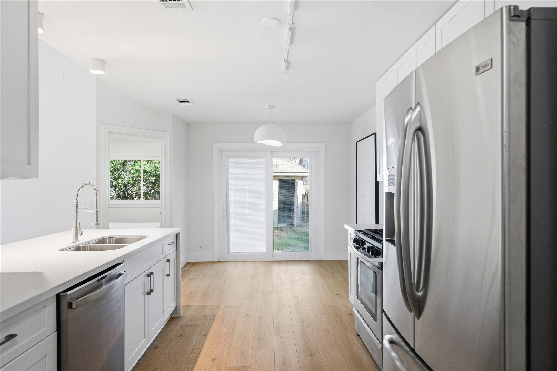 9019 Wellesley Drive Austin, TX 78754 - Photo 11 of 23 a spacious bathroom with a double vanity sink a mirror and a bathtub