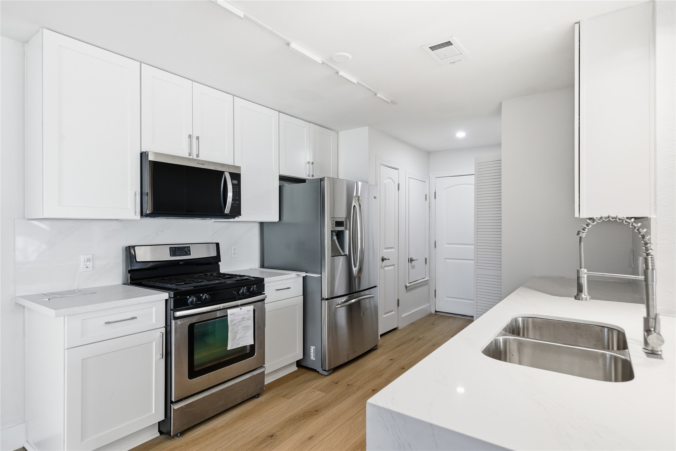 9019 Wellesley Drive Austin, TX 78754 - Photo 13 of 23 a kitchen that has a sink and a stove in it