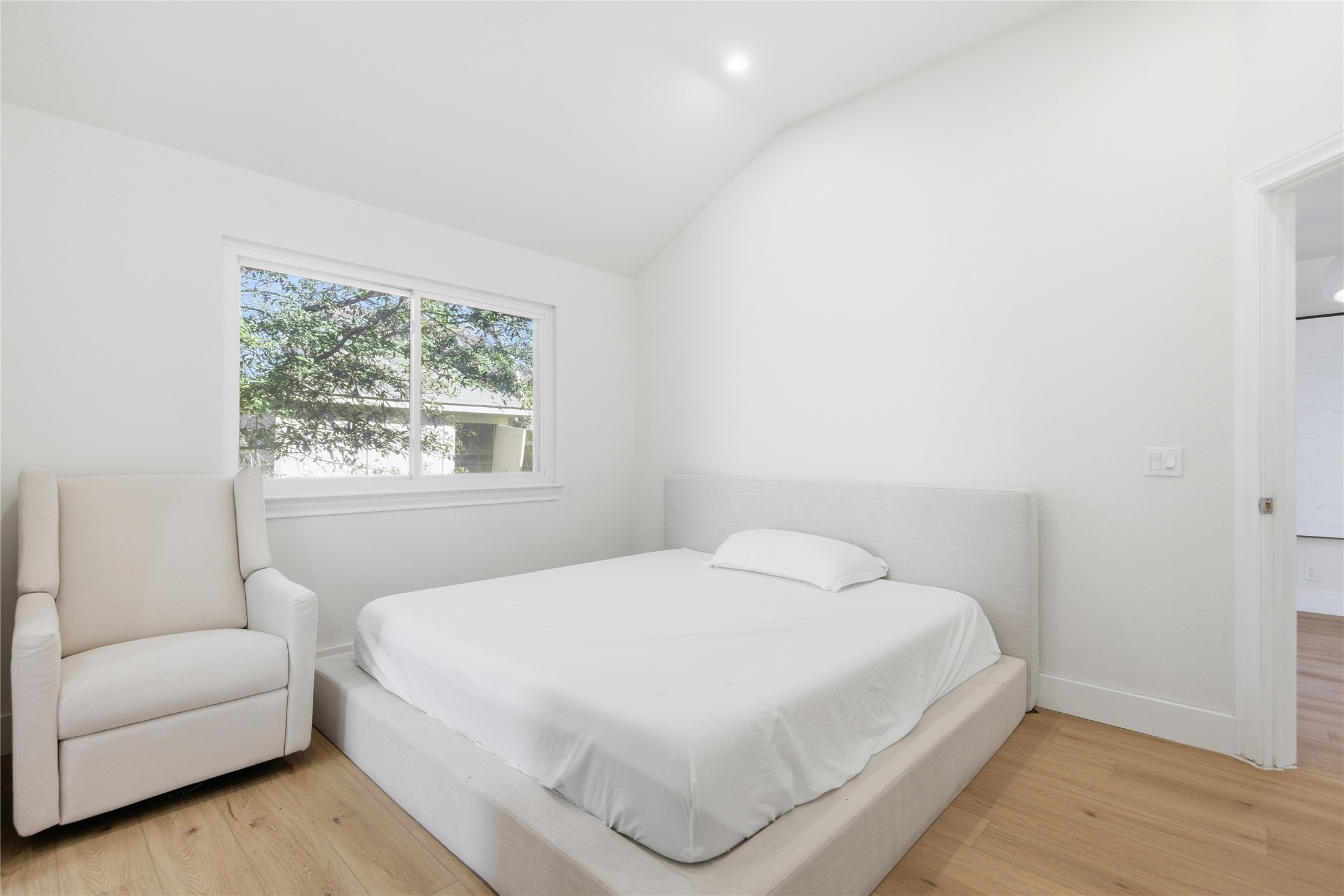 9019 Wellesley Drive Austin, TX 78754 - Photo 15 of 23 a bedroom with a bed and a couch with window