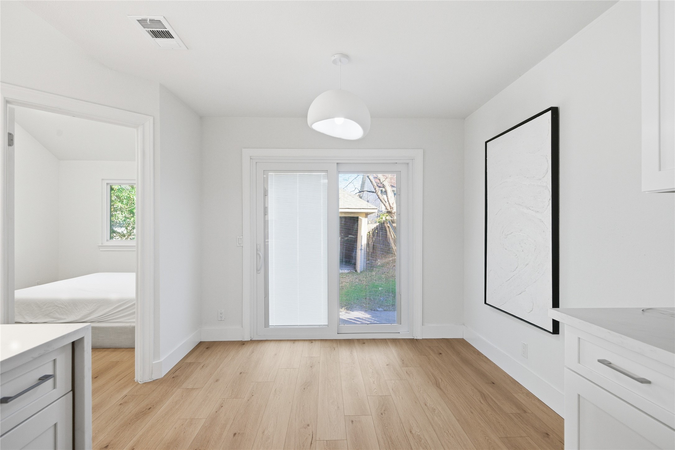 9019 Wellesley Drive Austin, TX 78754 - Photo 10 of 23 wooden floor in an empty room with a window