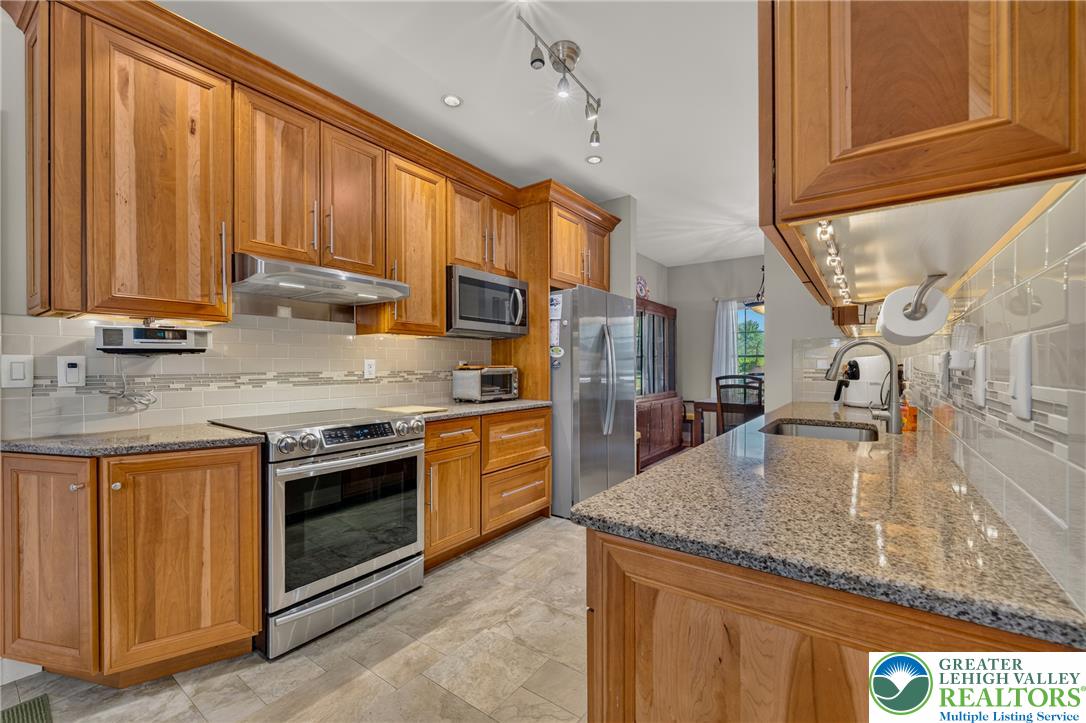 1702 Red Bud Road Quakertown, PA 18951 - Photo 15 of 68 A well-appointed kitchen features ample cabinetry and integrated appliances, perfect for daily meal preparation.