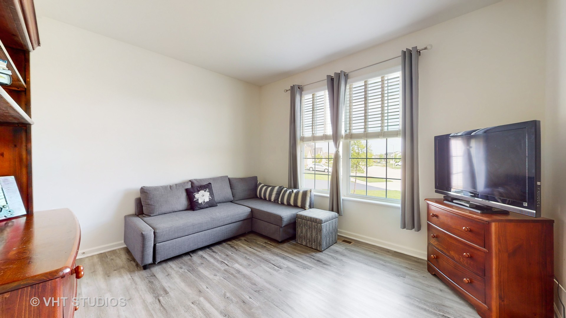 5841 Fairview Lane Hoffman Estates, IL 60192 - Photo 14 of 35 a living room with furniture and a flat screen tv
