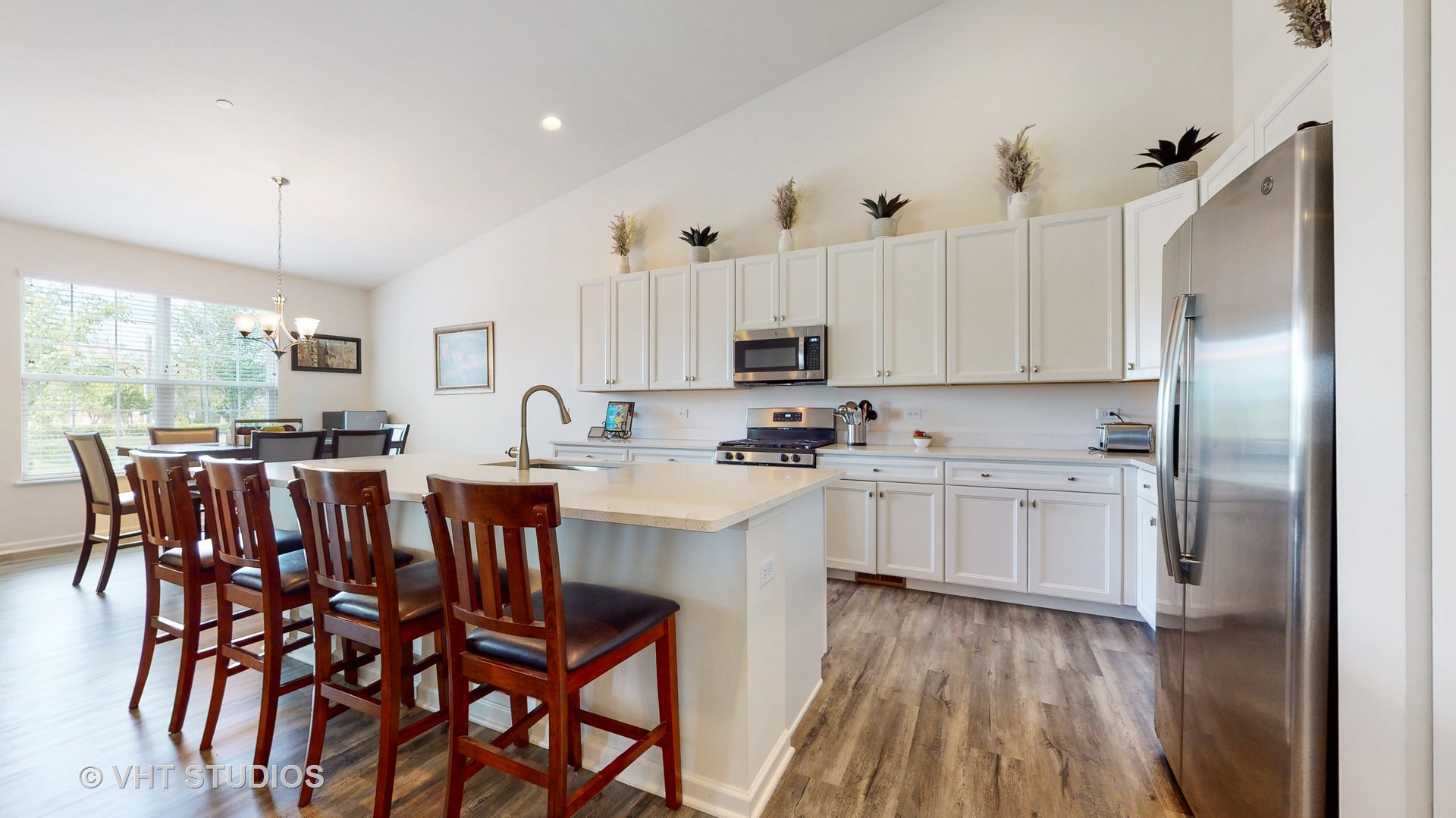 5841 Fairview Lane Hoffman Estates, IL 60192 - Photo 4 of 35 a kitchen with white cabinets and stainless steel appliances