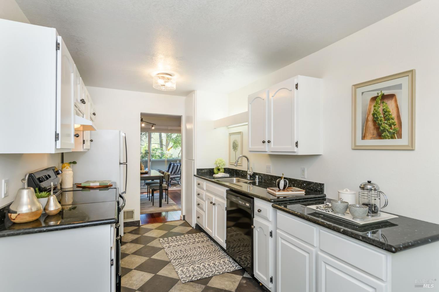 36 Schmidt Lane San Rafael, CA 94903 - Photo 13 of 31 a kitchen with granite countertop a sink stove and cabinets