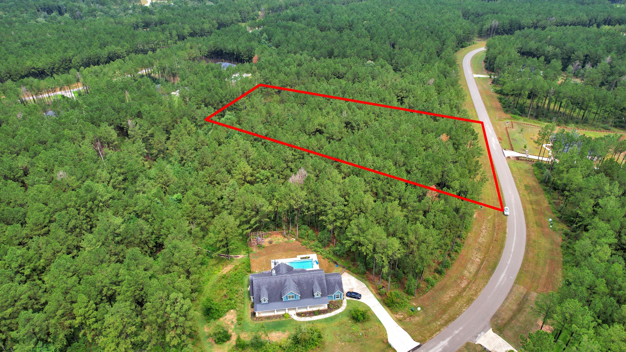 10940 Ruger Road Willis, TX 77378 - Photo 20 of 30 an aerial view of a house with a swimming pool