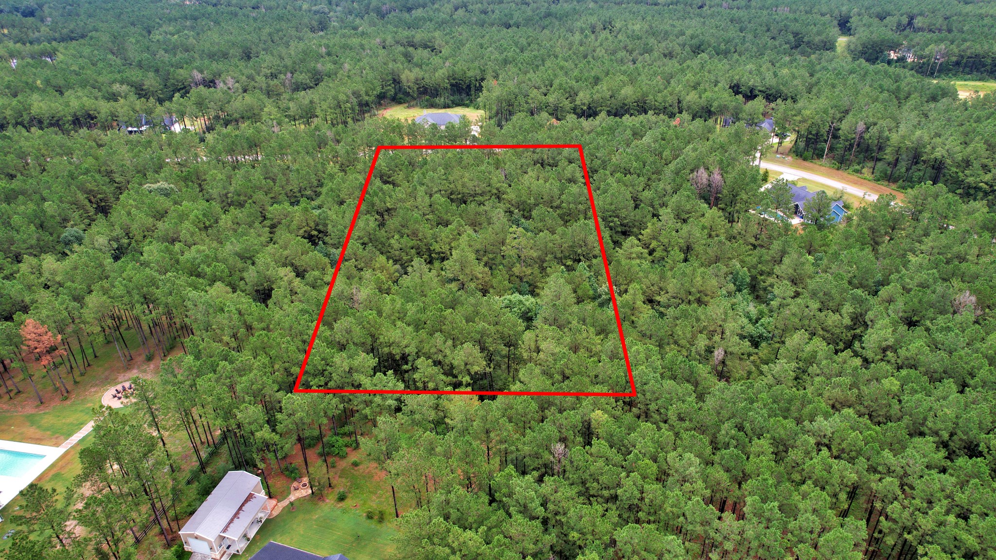 10940 Ruger Road Willis, TX 77378 - Photo 25 of 30 a aerial view of a houses with lots of trees