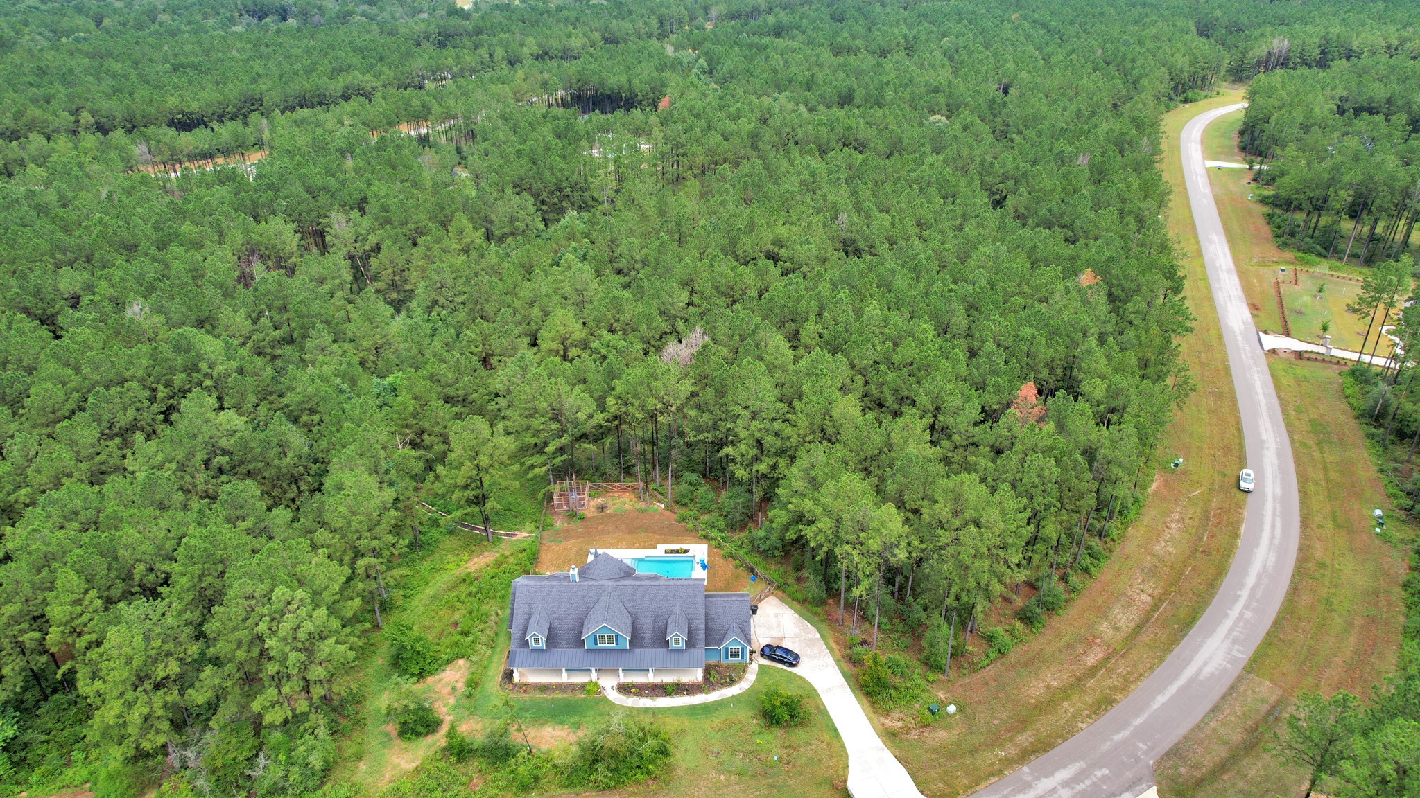 10940 Ruger Road Willis, TX 77378 - Photo 30 of 30 a view of a house with a swimming pool