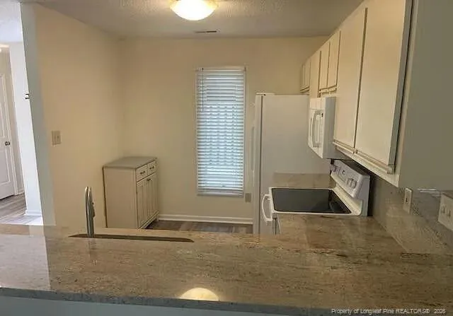a bathroom with a sink and a window