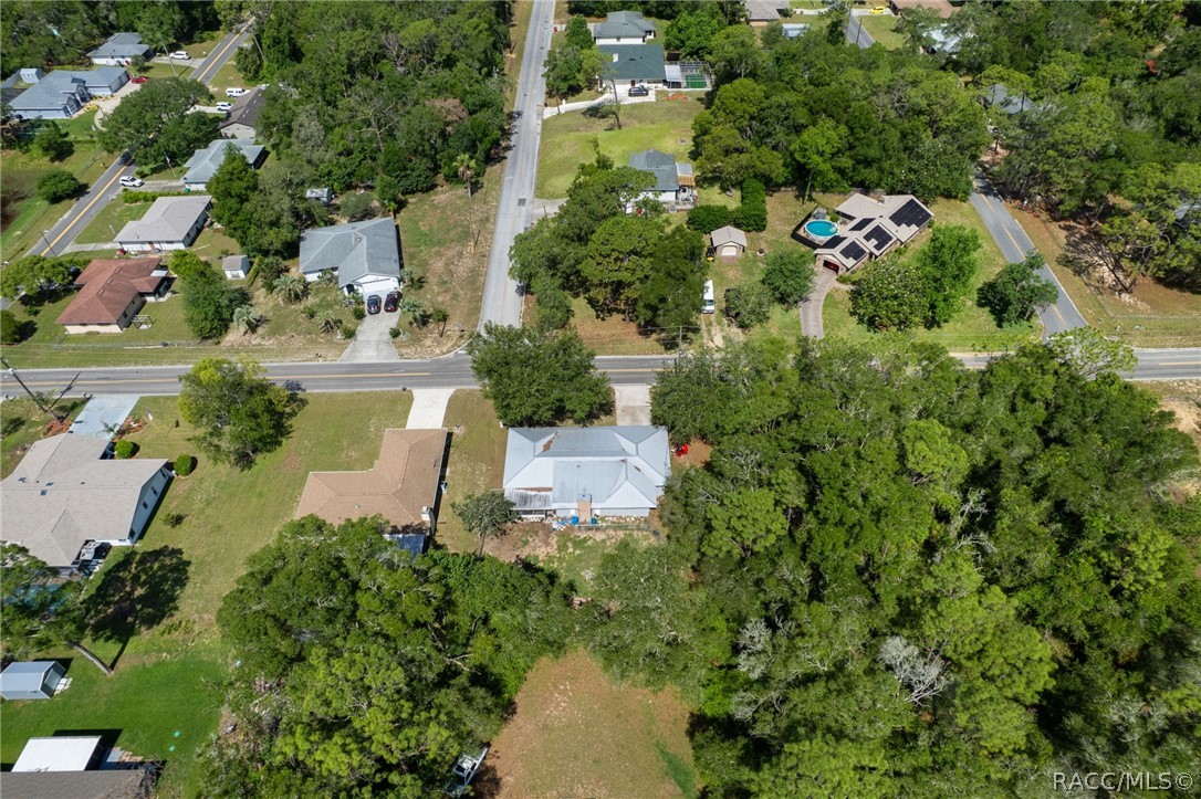1140 South Highlands Avenue Inverness, FL 34452 - Photo 40 of 54 an aerial view of residential house with outdoor space and trees all around