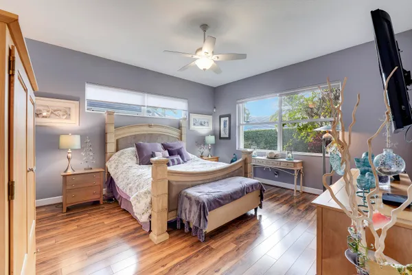 a spacious bathroom with a granite countertop tub sink and mirror