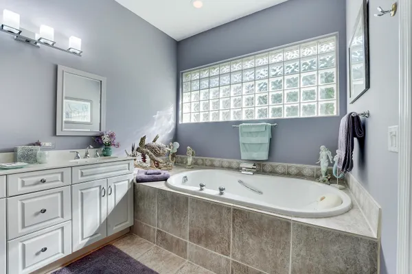 a view of a porch with furniture and garden