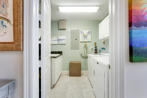 a living room filled with furniture and flowers