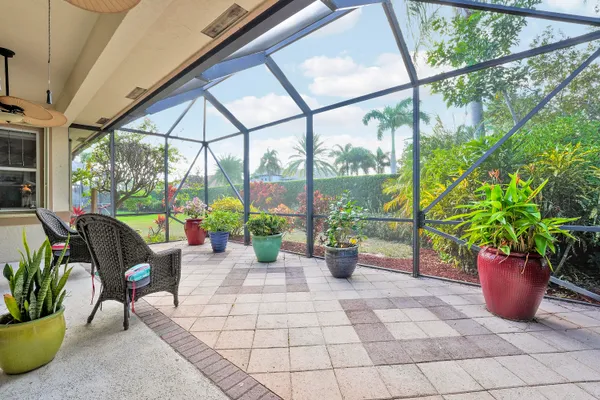 an aerial view of a residential houses with outdoor space swimming pool