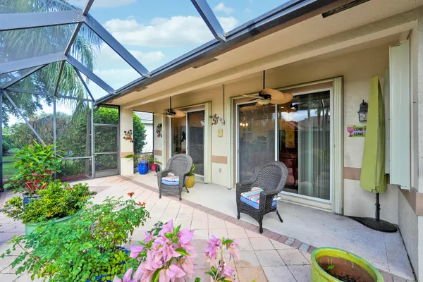 a view of a street with palm trees