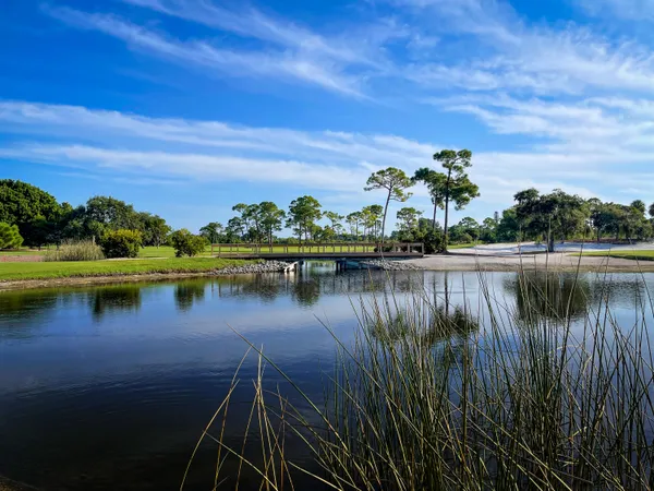 a living room with a table and chairs