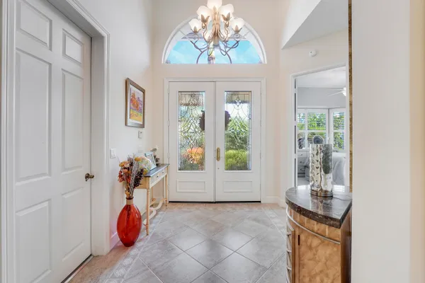 a dining room with furniture and a window