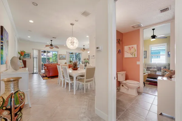a bathroom with a sink mirror and toilet