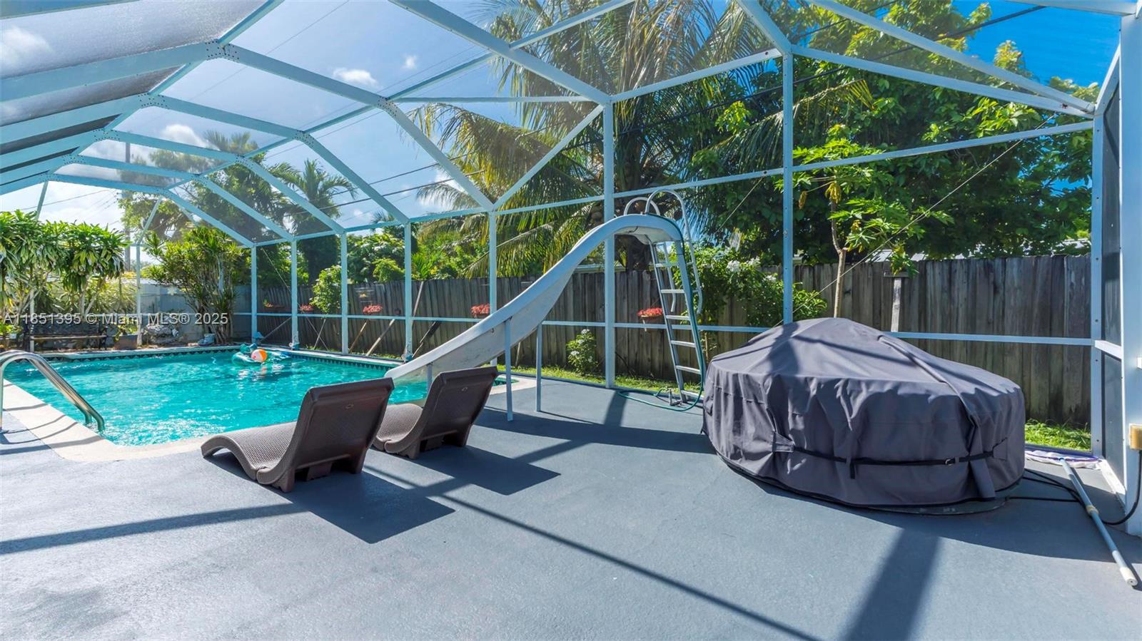 8711 Southwest 191st Street Cutler Bay, FL 33157 - Photo 13 of 56 a house view with a sitting space and garden space