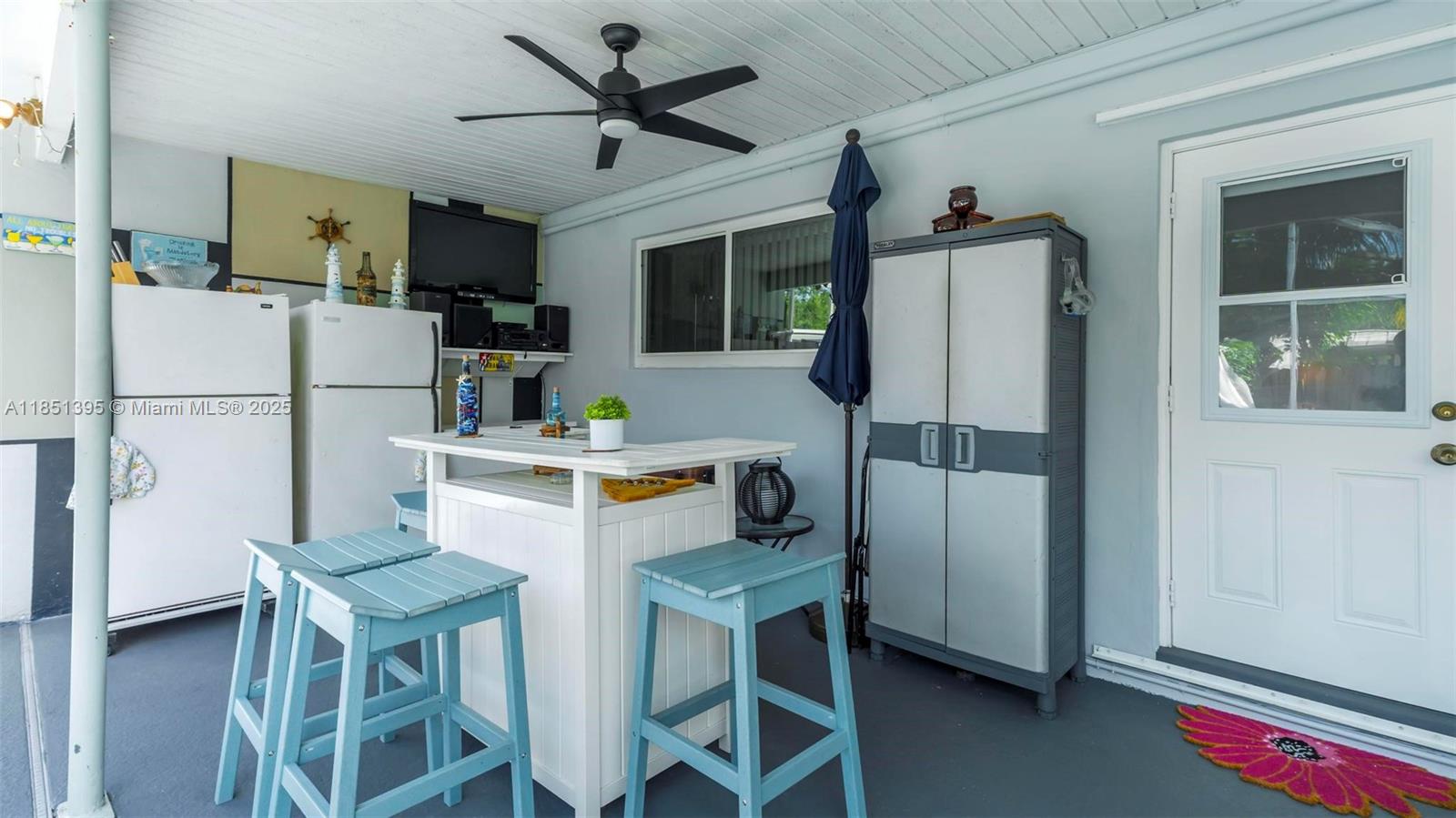 8711 Southwest 191st Street Cutler Bay, FL 33157 - Photo 16 of 56 a kitchen with stainless steel appliances a refrigerator a stove a microwave oven a sink dishwasher and white cabinets with wooden floor