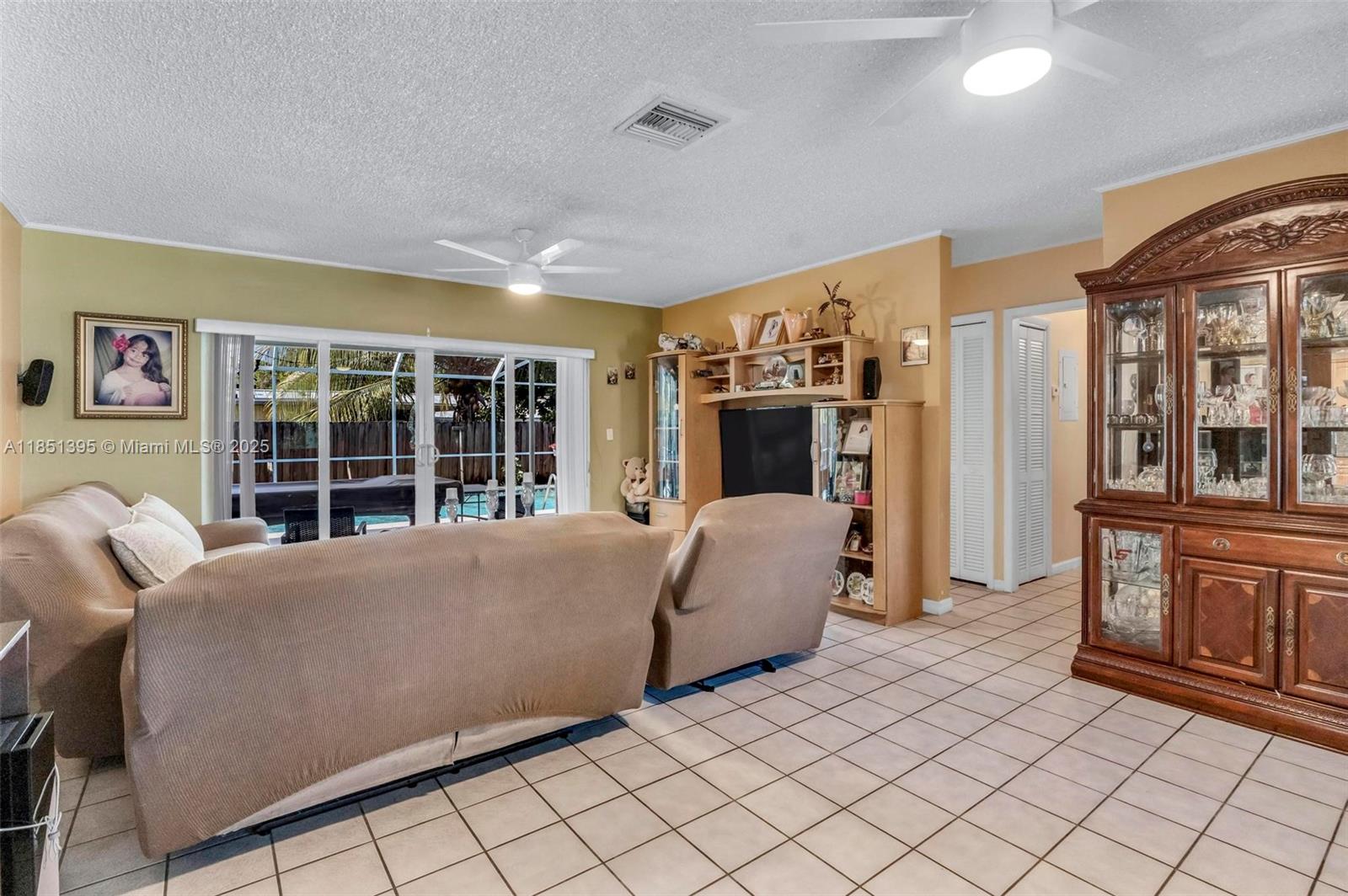 8711 Southwest 191st Street Cutler Bay, FL 33157 - Photo 17 of 56 a living room with furniture and a fireplace