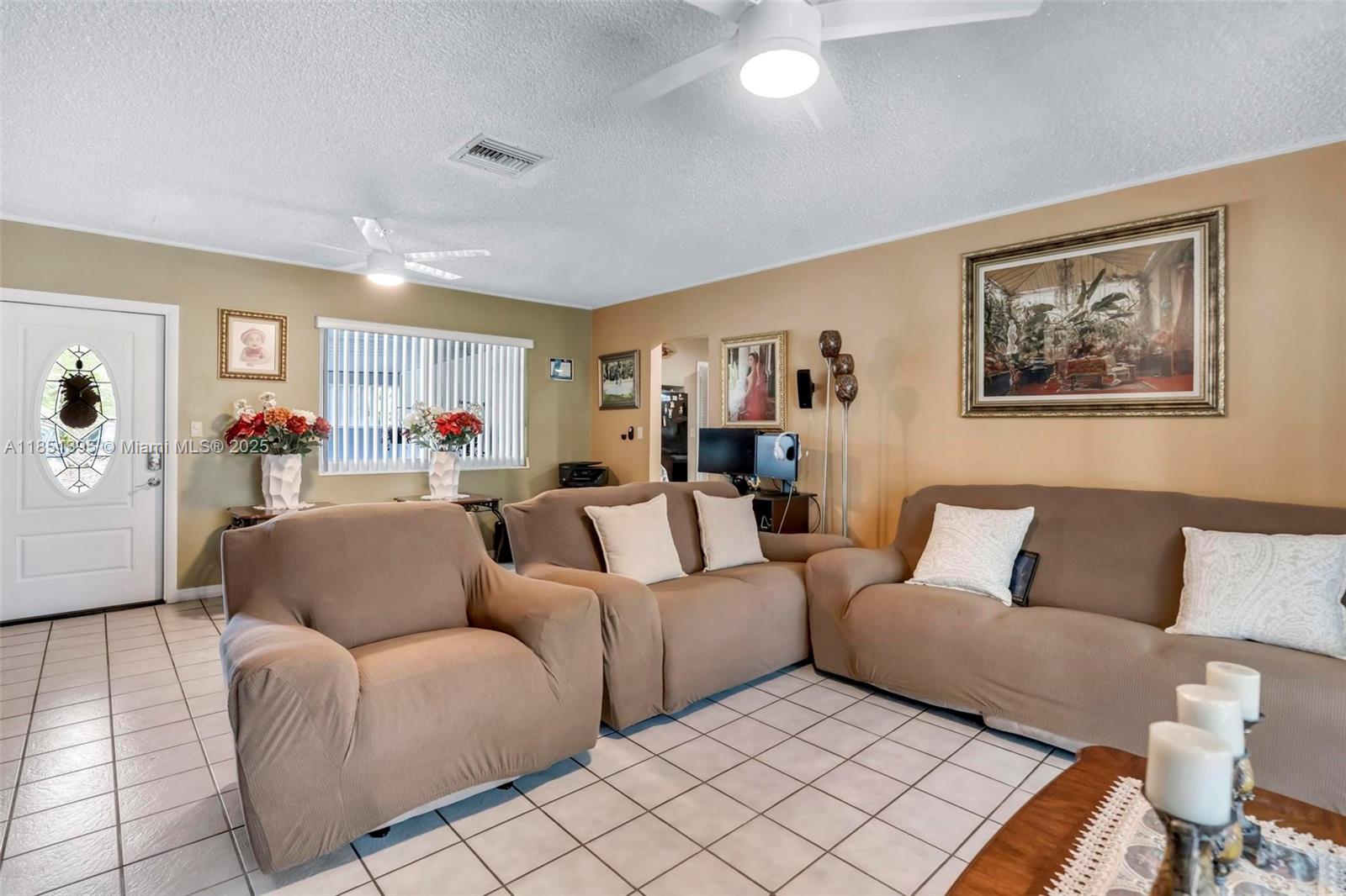 8711 Southwest 191st Street Cutler Bay, FL 33157 - Photo 19 of 56 a living room with furniture and a couch