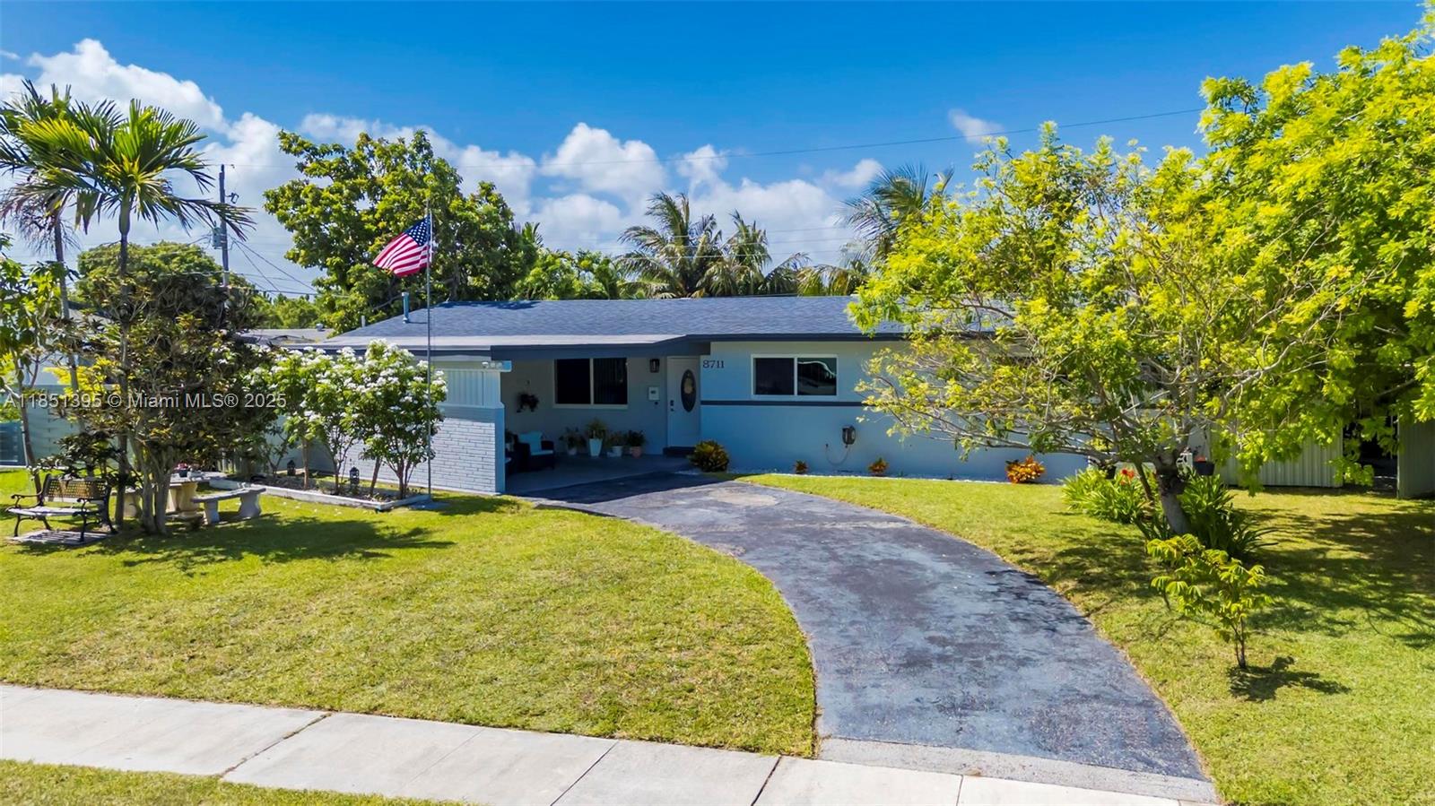 8711 Southwest 191st Street Cutler Bay, FL 33157 - Photo 2 of 56 a swimming pool with outdoor seating and yard