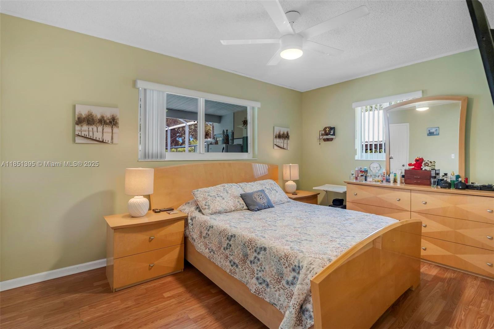 8711 Southwest 191st Street Cutler Bay, FL 33157 - Photo 26 of 56 a living room with furniture and a flat screen tv