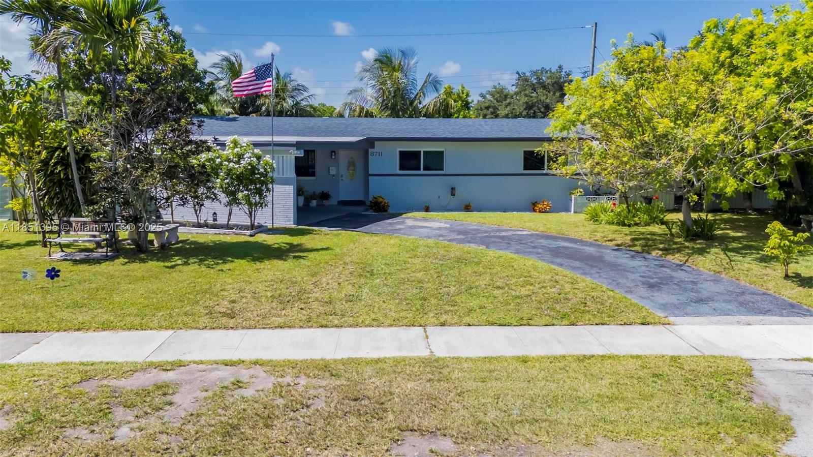 8711 Southwest 191st Street Cutler Bay, FL 33157 - Photo 3 of 56 a view of a house with a swimming pool
