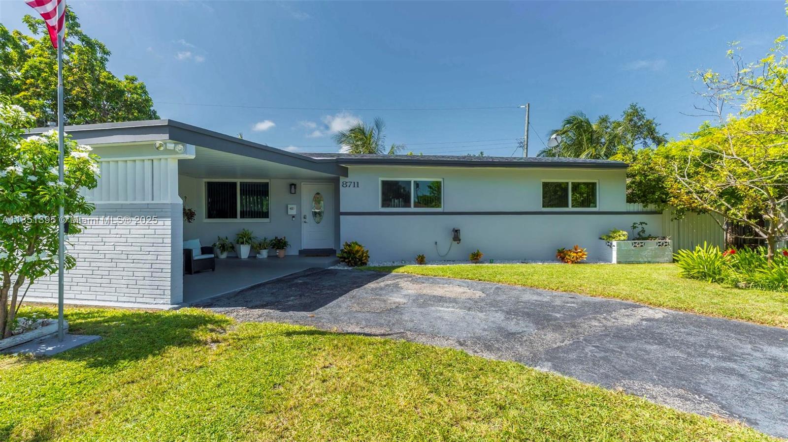 8711 Southwest 191st Street Cutler Bay, FL 33157 - Photo 35 of 56 a house view with swimming pool and garden space