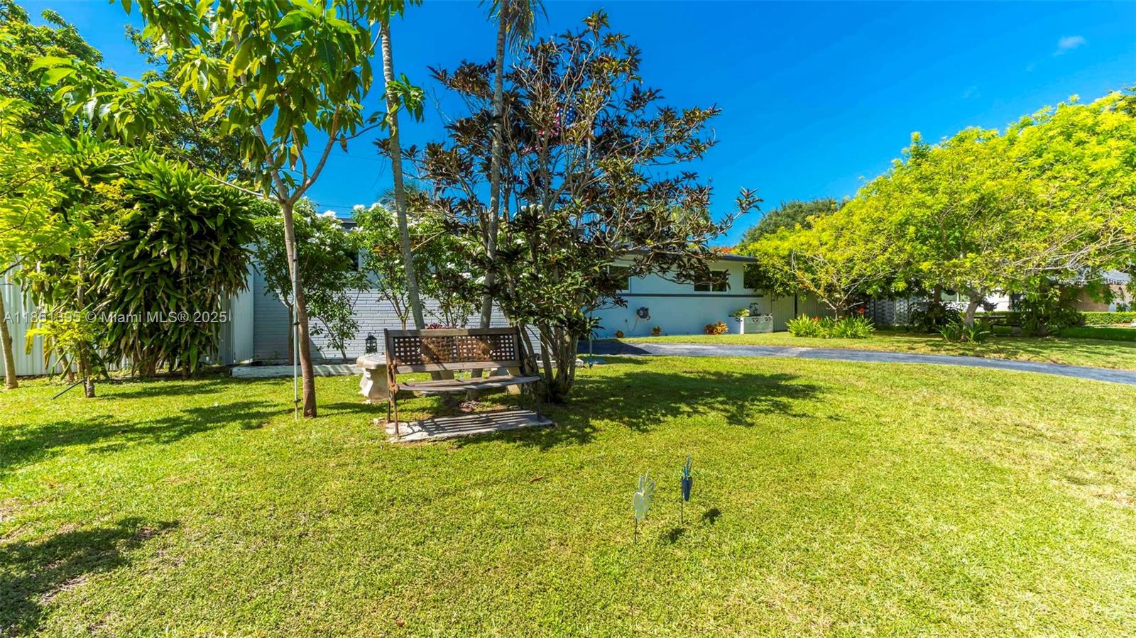 8711 Southwest 191st Street Cutler Bay, FL 33157 - Photo 37 of 56 a view of a garden with swimming pool