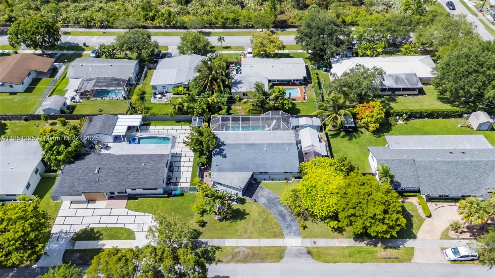 8711 Southwest 191st Street Cutler Bay, FL 33157 - Photo 39 of 56 an aerial view of a house with a garden and swimming pool