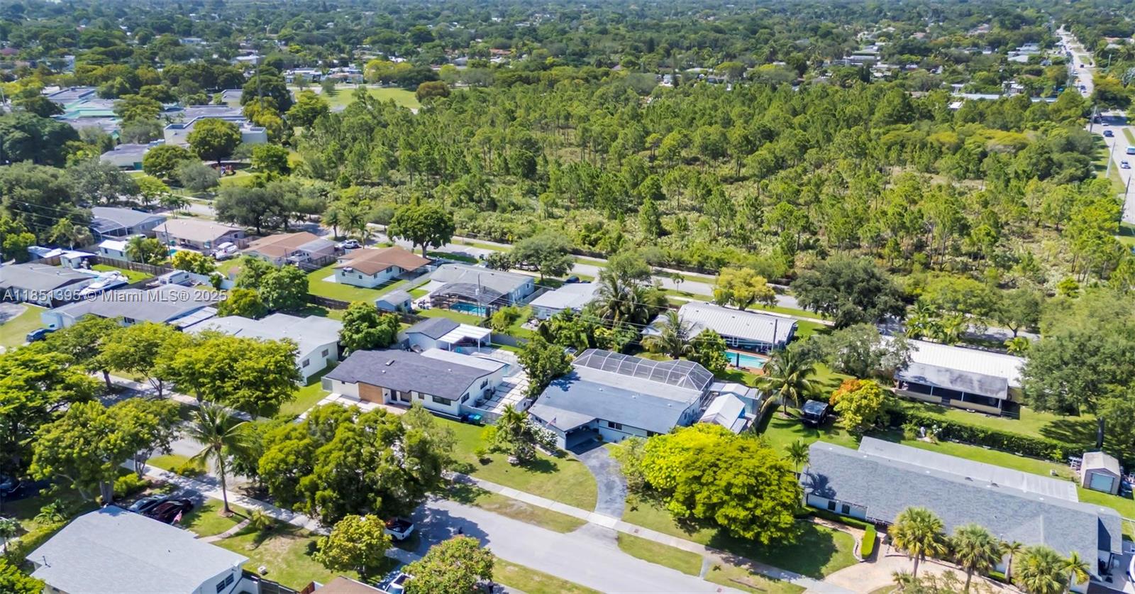 8711 Southwest 191st Street Cutler Bay, FL 33157 - Photo 41 of 56 an aerial view of residential houses with outdoor space and trees
