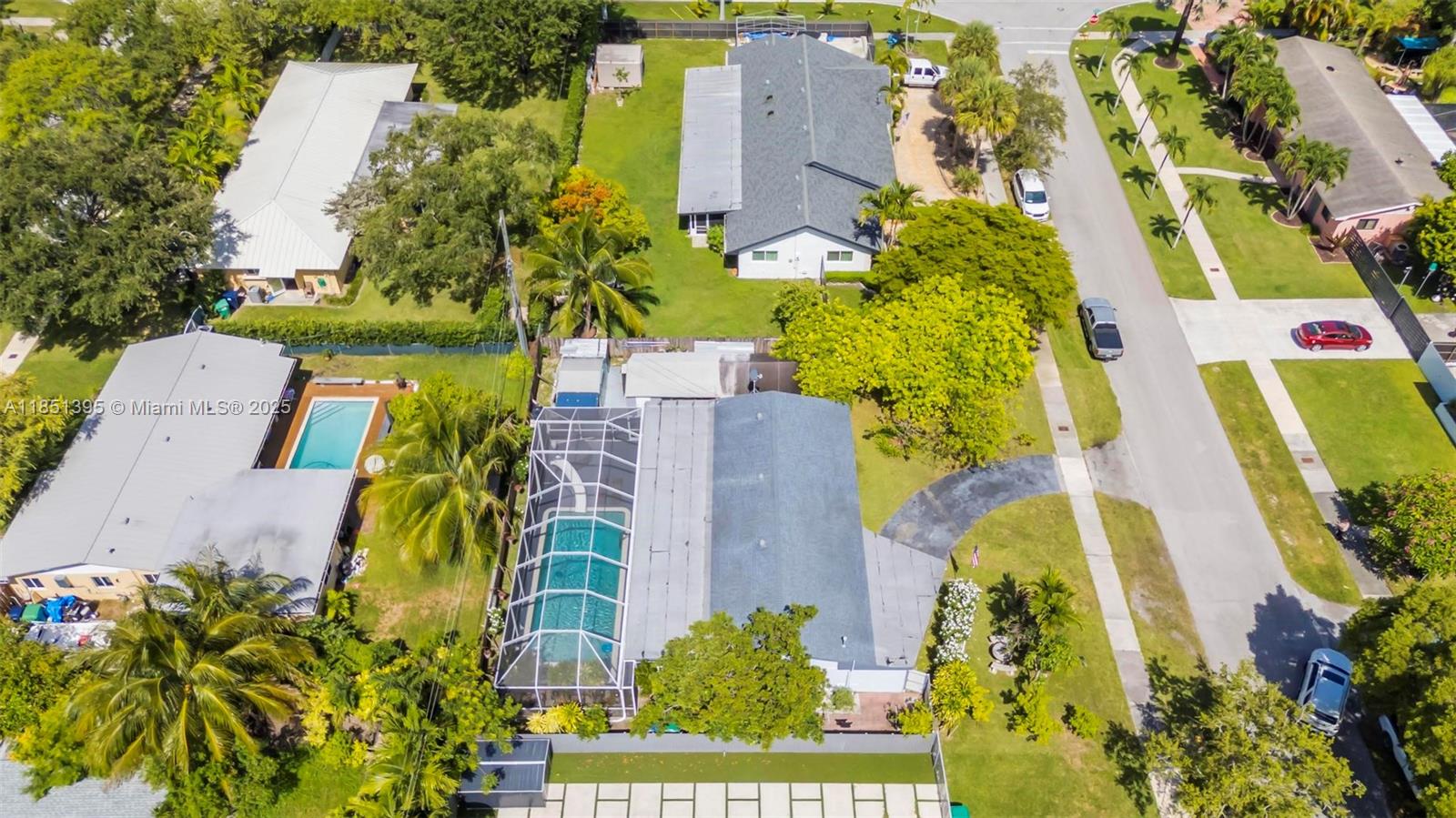 8711 Southwest 191st Street Cutler Bay, FL 33157 - Photo 45 of 56 an aerial view of a residential apartment building with a yard and garden