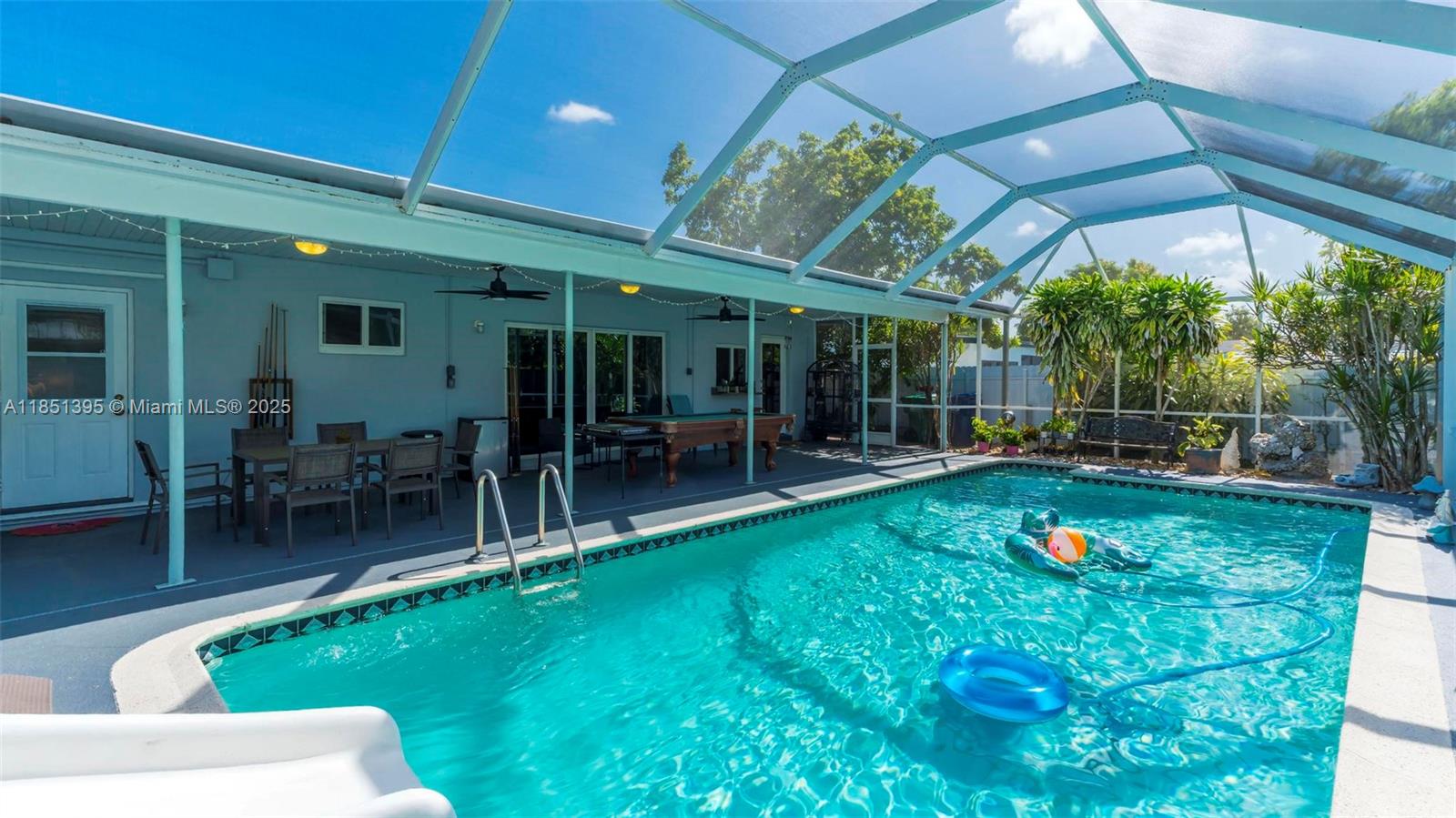 8711 Southwest 191st Street Cutler Bay, FL 33157 - Photo 7 of 56 a view of a swimming pool with a patio