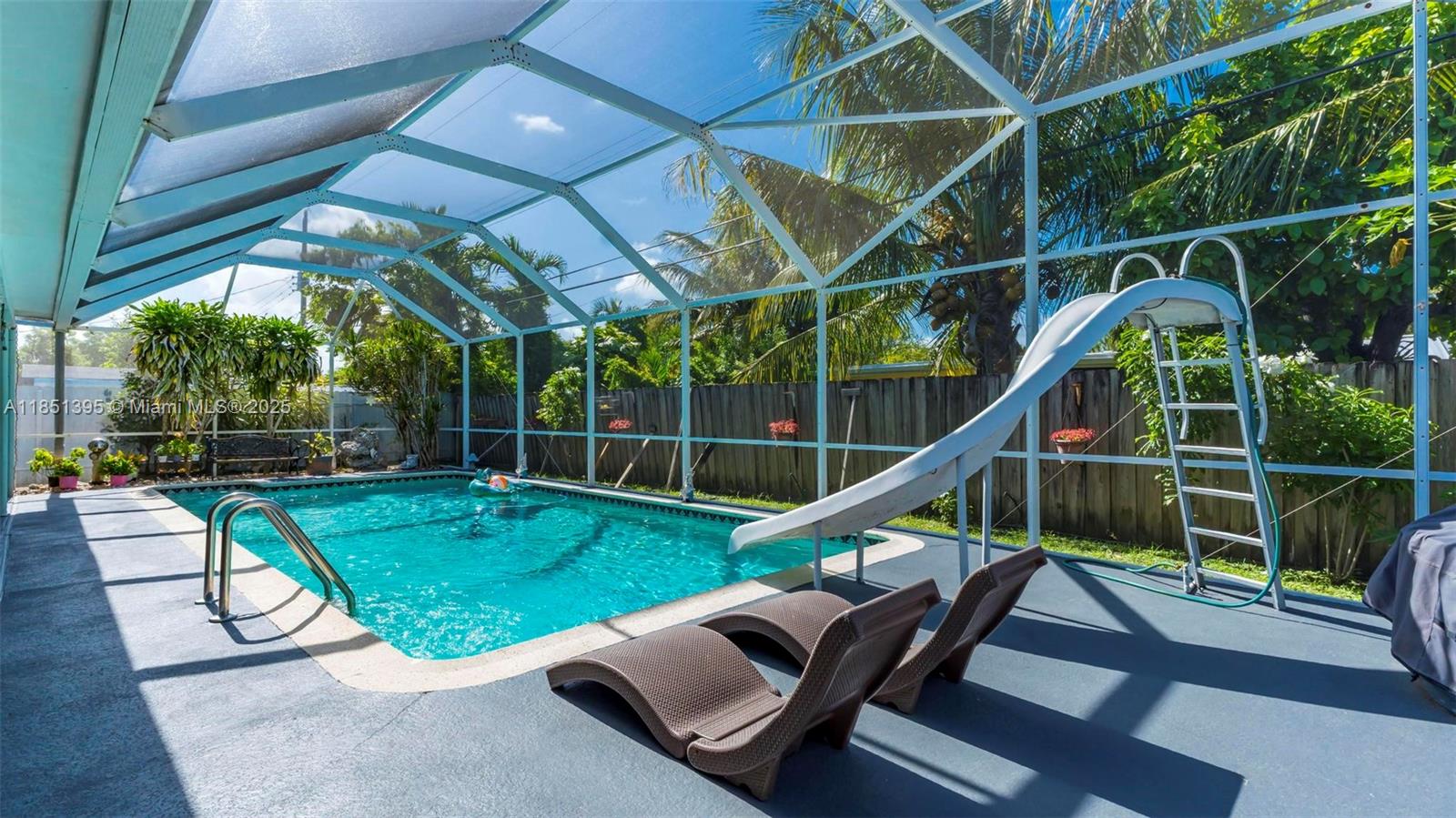 8711 Southwest 191st Street Cutler Bay, FL 33157 - Photo 8 of 56 a view of a chairs and table in the patio
