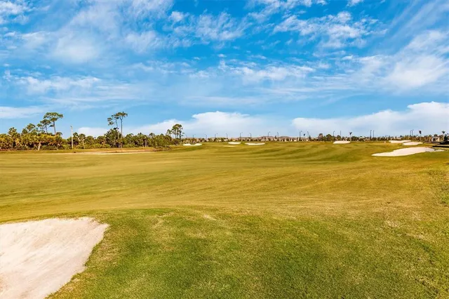 a front view of a house with glass windows and furniture